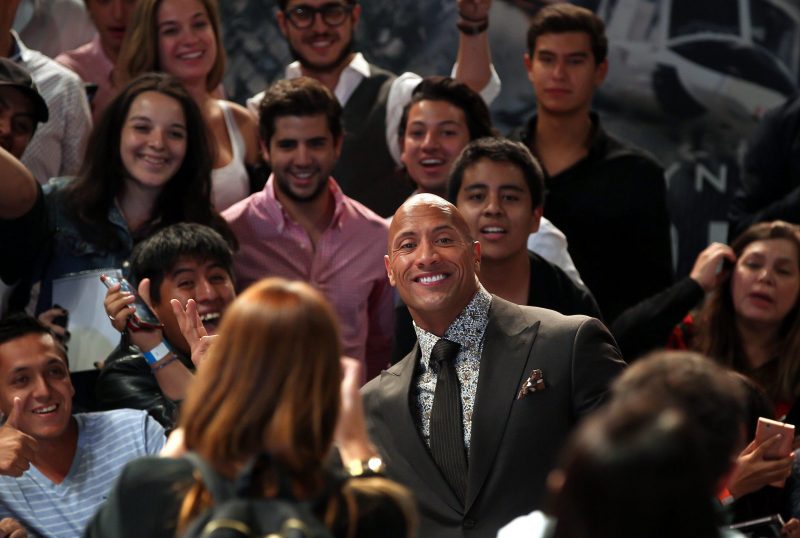 US actor Dwayne Johnson (C) poses for fans during an event promoting his movie 'San Andreas' in Mexico City, Mexico, 23 May 2015. EPA/ALEX CRUZ