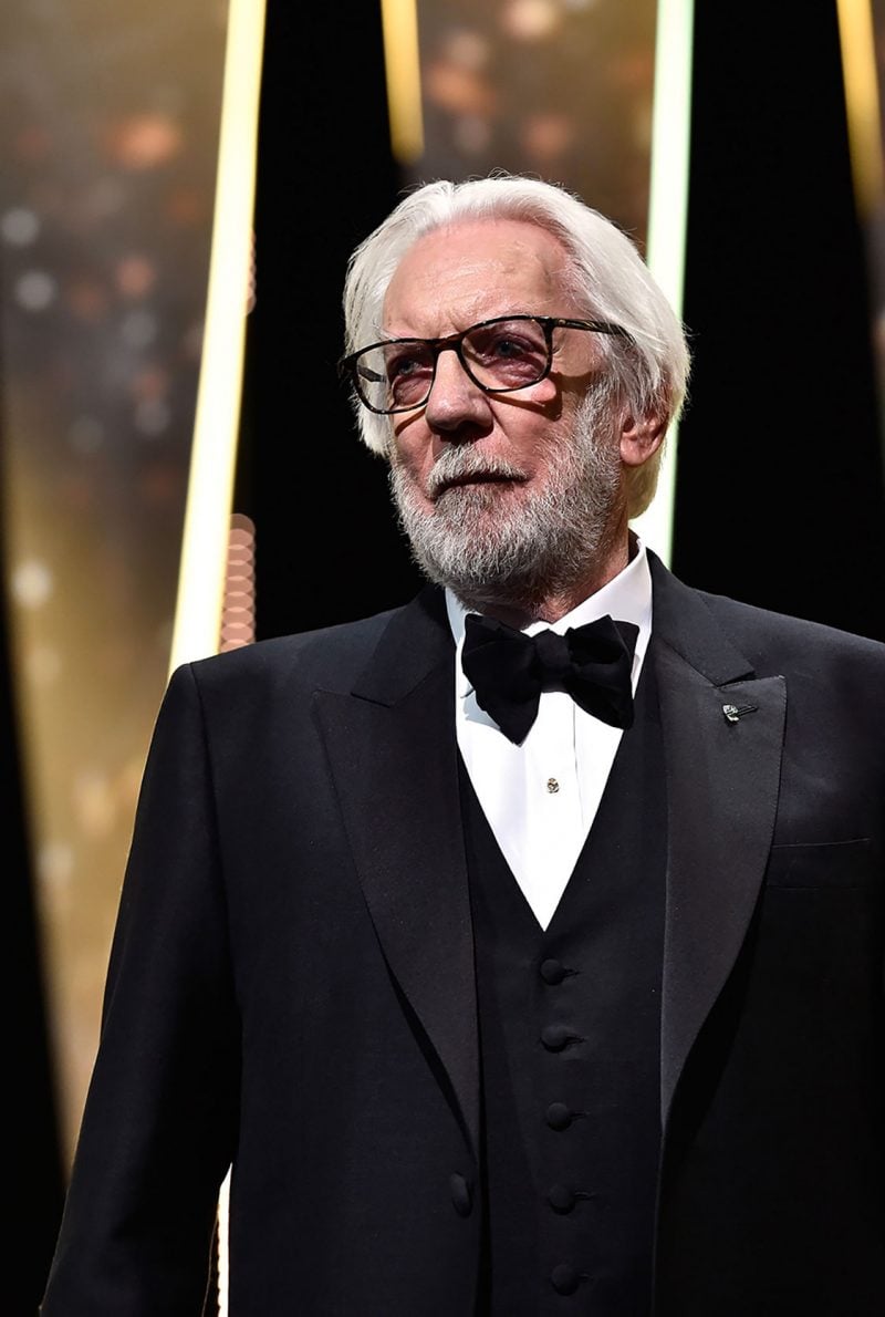 Donald Sutherland, member of the 69th Cannes Film Festival jury, wore a Brioni by Justin O’Shea black three-piece mohair bespoke tuxedo with satin peak lapel during the Opening Gala Ceremony.