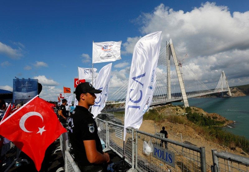 A riot police stands guard during the opening ceremony of newly built Yavuz Sultan Selim bridge, the third bridge over the Bosphorus linking the city's European and Asian sides in Istanbul, Turkey, August 26, 2016. REUTERS/Murad Sezer - 