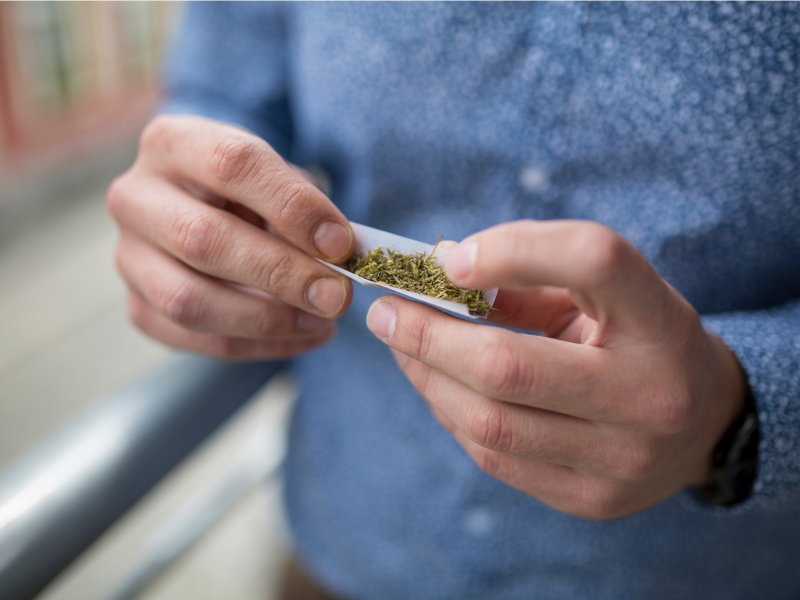Man Rolling a Marijuana joint