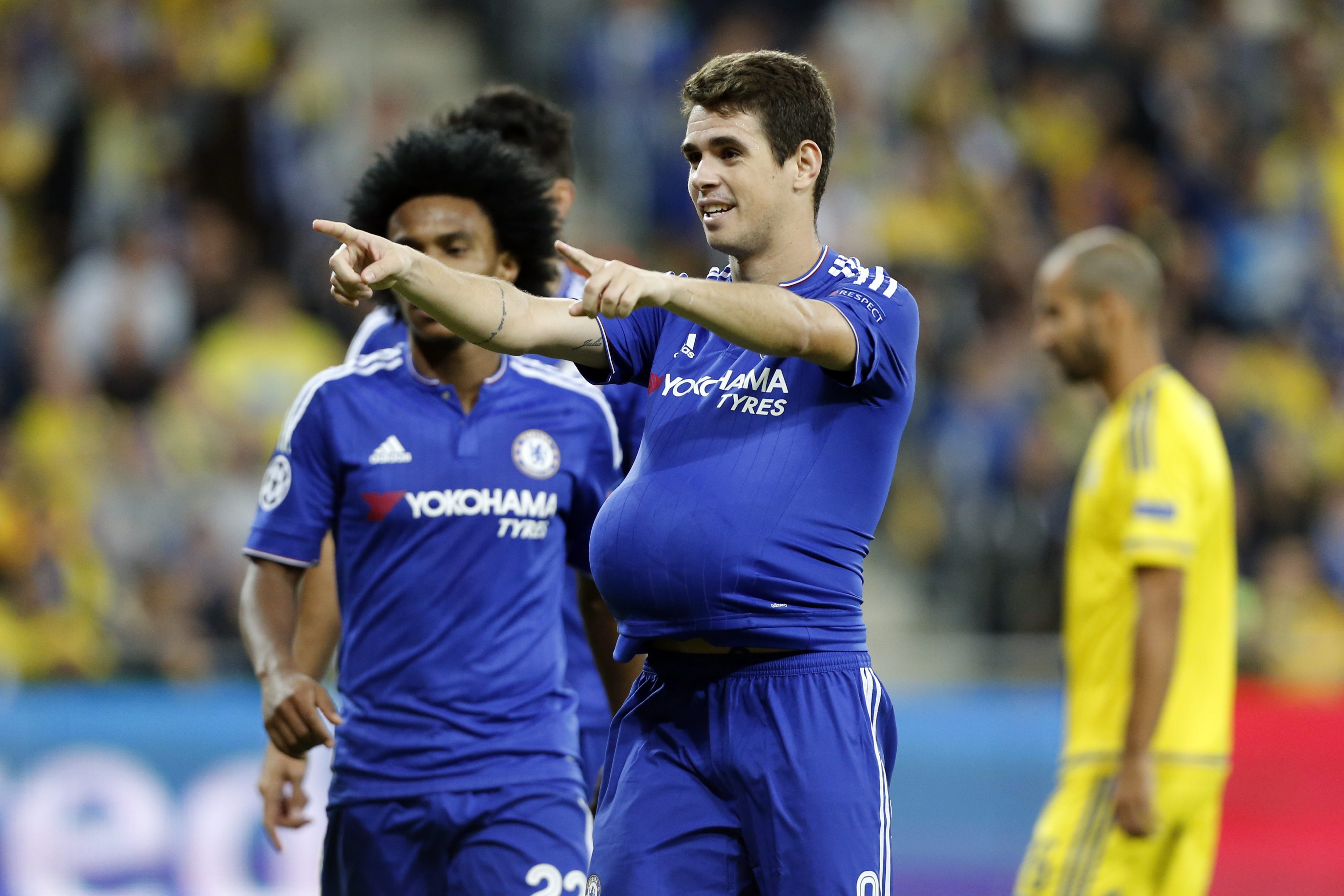 2015-11-24 00:00:00 epa05040499 Oscar of Chelsea celebrates after scoring the 3-0 during the UEFA Champions League Group G second match between Chelsea and Maccabi Tel-Aviv at the Sammy Ofer Stadium in Haifa, Israel, 24 November 2015. EPA/ABIR SULTAN