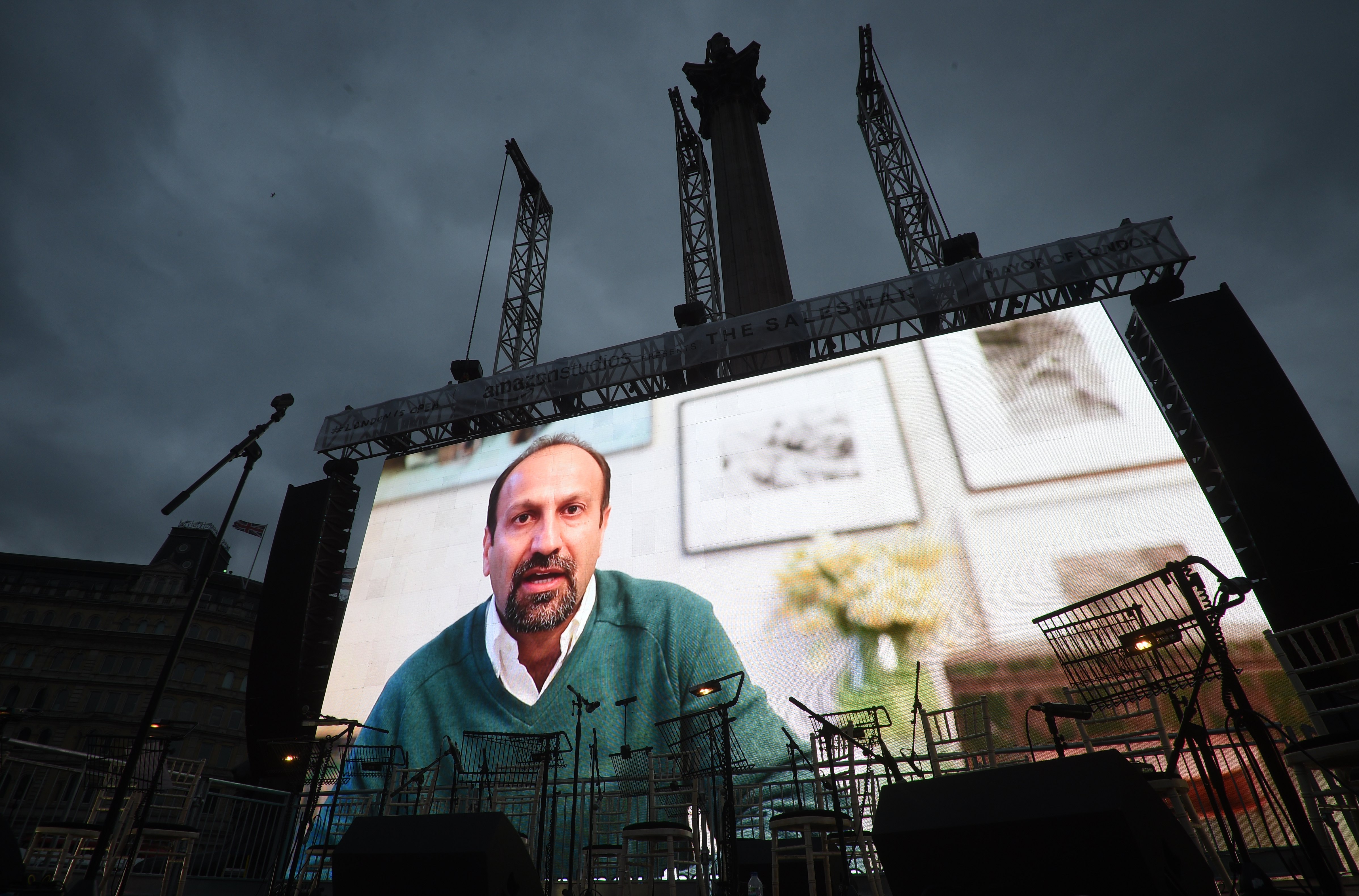 2017-02-26 16:44:31 epa05816685 Iranian film director, Asghar Farhadi, is seen on a screen as he sends a video message during a screening of his Oscar-nominated film 'the Salesman' in Traflagar Square in London, Britain, 26 February 2017. The film director Asghar Farhadi announced he will not attend for the Oscar ceremony on 26 february in Los Angeles, following US Presidents Donald J.Trump executive order banning travel to the United States from seven Muslim-majority countries. EPA/FACUNDO ARRIZABALAGA