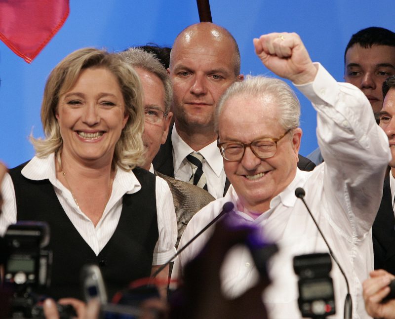 Jean-Marie Le Pen (R) , France's National Front far-right political party presidential candidate and his daughter Marine wave to supporters in Paris after the announcement of results in the first round vote April 22, 2007.