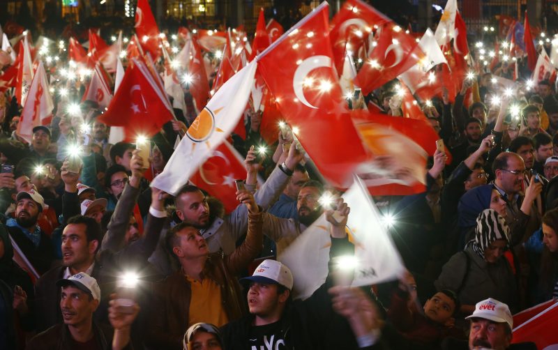 Supporters of AK party light their mobiles as they react at the party headquarters in Ankara, Turkey, April 16, 2017.
