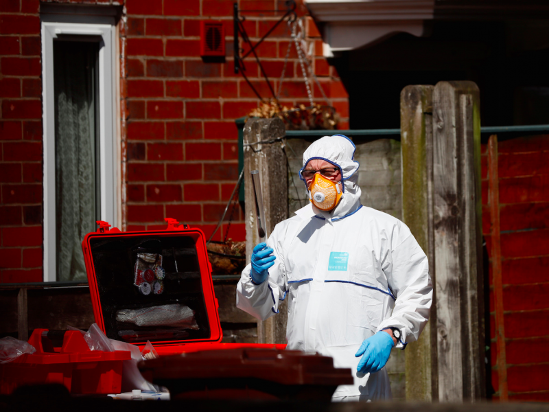 Police investigators work at residential property in south Manchester, Britain May 23, 2017.