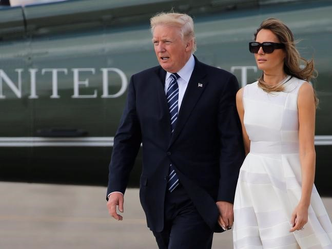 U.S. President Donald Trump and first lady Melania Trump hold hands as they arrive to board Air Force One for travel to Rome from Ben Gurion International Airport in Tel Aviv, Israel May 23, 2017. REUTERS/Jonathan Ernst