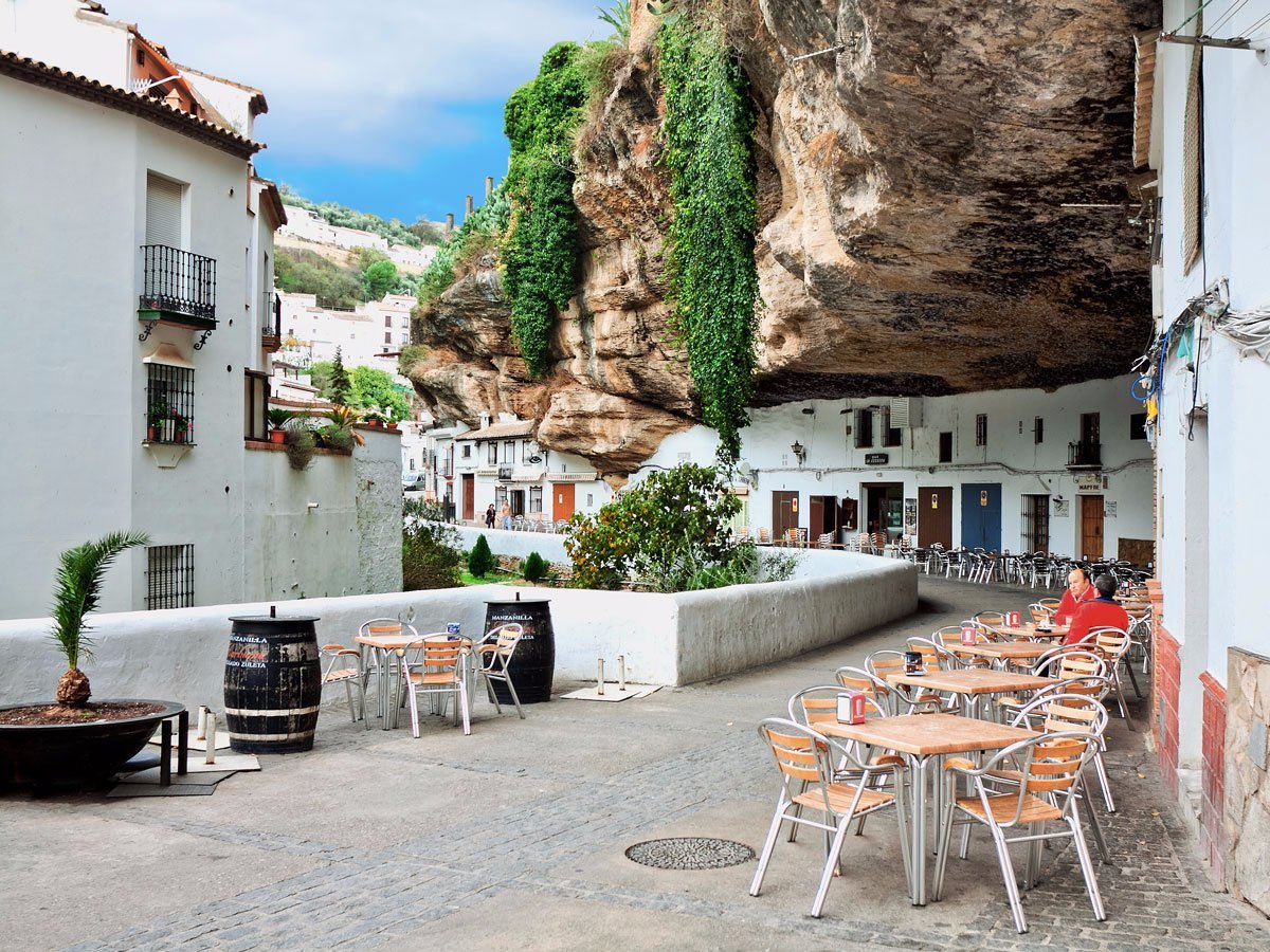 setenil-de-las-bodegas-grew-out-of-a-network-of-caves-located-in-the-cliffs-above-the-rio-trejo-in-spain