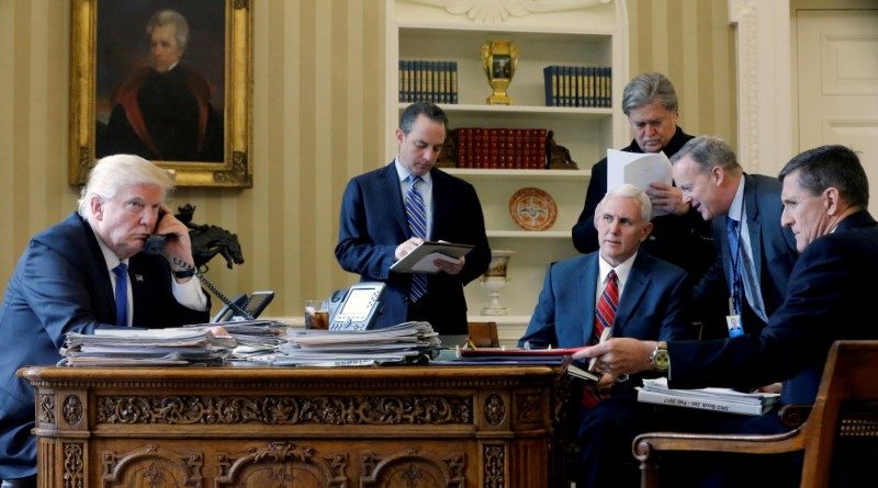 FILE PHOTO: - U.S. President Donald Trump (L-R), joined by Chief of Staff Reince Priebus, Vice President Mike Pence, senior advisor Steve Bannon, Communications Director Sean Spicer and then National Security Advisor Michael Flynn, speaks by phone with Russia's President Vladimir Putin in the Oval Office at the White House in Washington, U.S. on January 28, 2017.     REUTERS/Jonathan Ernst/File Photo