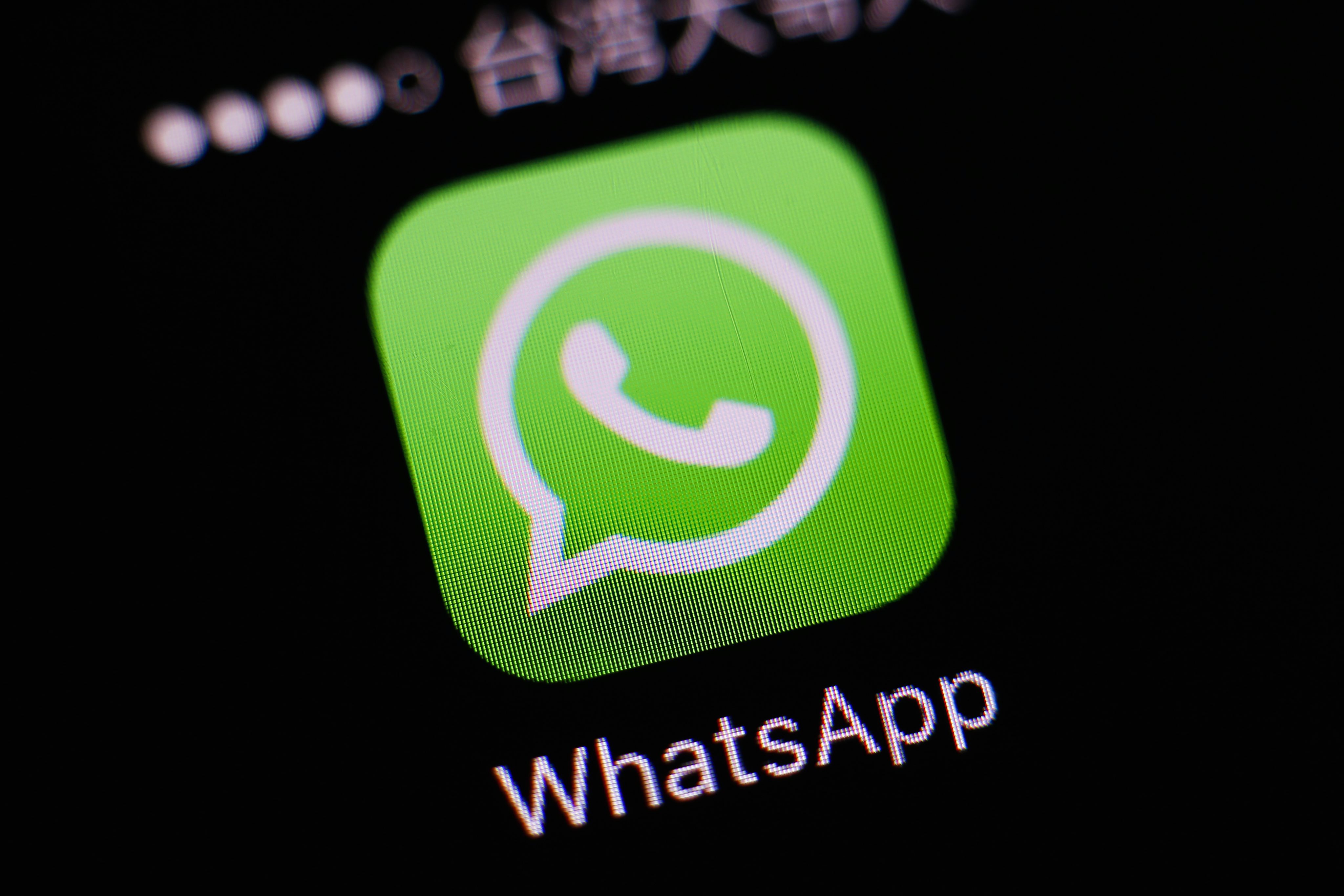 2016-04-07 10:10:23 epa05247658 The logo of the messaging application WhatsApp is pictured on a smartphone in Taipei, Taiwan, 07 April 2016. WhatsApp on 05 April 2016 rolled out its end-t-end (E2E) encryption for its more than one billion users. The most popular messaging application is owned by Facebook. EPA/RITCHIE B. TONGO