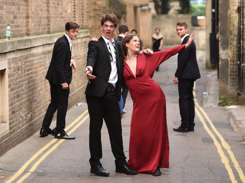 Students from Cambridge University make their way home after celebrating the end of the academic year at the May Balls.