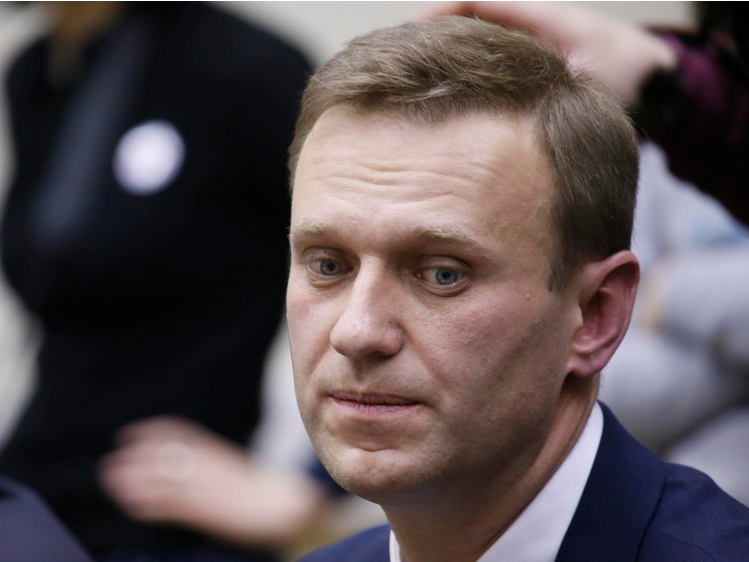 FILE PHOTO: Russian opposition leader Alexei Navalny submits his documents to be registered as a presidential candidate at the Central Election Commission in Moscow, Russia December 24, 2017. REUTERS/Tatyana Makeyeva