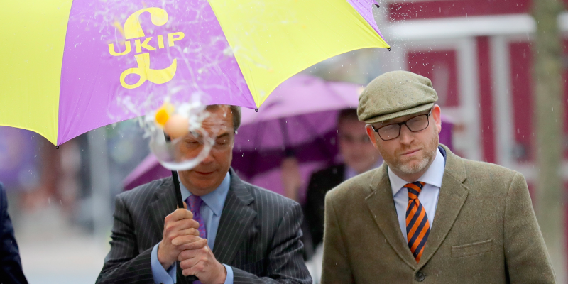 UKIP leader Paul Nuttall (R) and former Leader Nigel Farage MEP dodge an egg thrown by a youth as they arrive in Stoke-On-Trent for a public meeting this evening on February 6, 2017 in Stoke, England. The Stoke-on-Trent central by-election has been called after sitting Labour MP Tristram Hunt resigned from his seat to be a museum director. The seat has always been a Labour stronghold but will see fierce competition from The United Kingdom Independence Party (UKIP) as they target people who voted for Brexit and the tradtional Labour working classes. (Photo by )