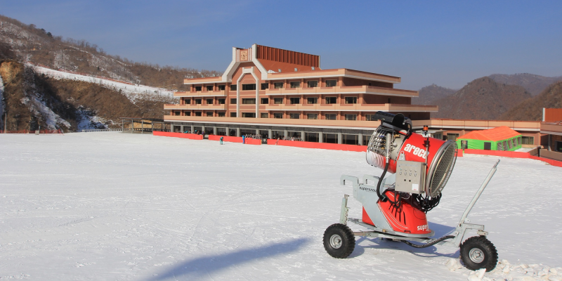 An Italian-made Areco snow cannon sits on the beginner slope in front of the Masikryong Hotel at the new Masik Ski Resort January 29, 2014 near Wonsan in northeastern North Korea. The screen displays music videos of popular North Korean songs, as well as statistics about mountain conditions. The resort reportedly boasts a 250-room, eight-story hotel for foreigners, 10 ski runs and is thought to have cost $300 million.