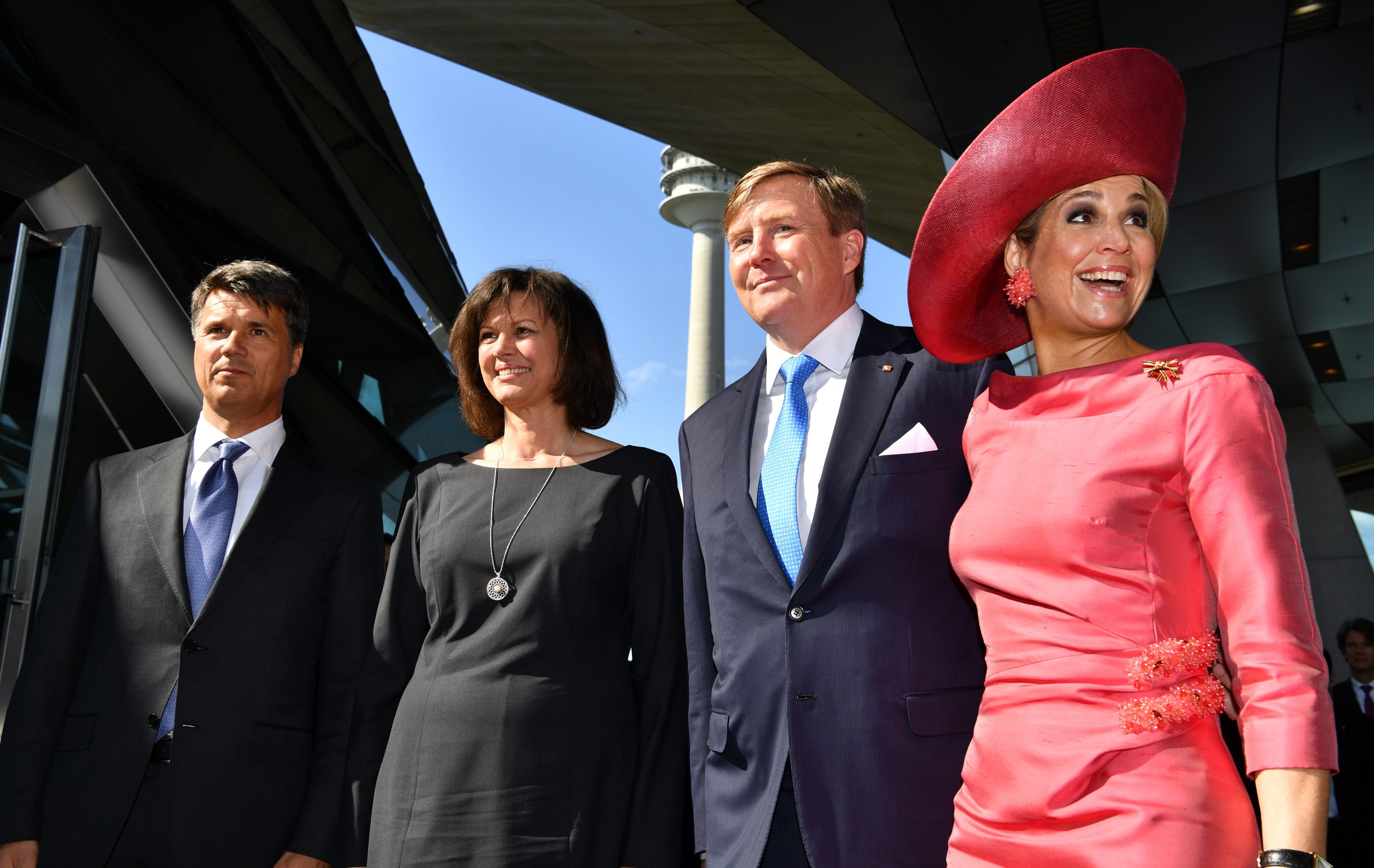2016-04-13 00:00:00 epa05256491 Queen Maxima (R) and King Willem-Alexander (2 R) of the Netherlands pay a visit to 'BMW World' in Munich, Germany, 13 April 2016. Greeting them is BMW CEO Harald Krueger (L) and Bavarian State Minister for Energy and TechnologyIlse Aigner (2-L). The Dutch Royal couple are on a two day visit of the southern German state of Bavaria. EPA/PETER KNEFFEL