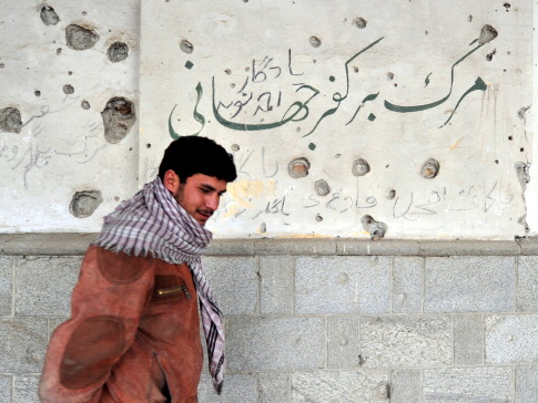 Afghanistan man grafitti infidel
