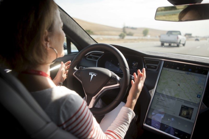 FILE PHOTO - New Autopilot features are demonstrated in a Tesla Model S during a Tesla event in Palo Alto, California October 14, 2015. REUTERS/Beck Diefenbach 