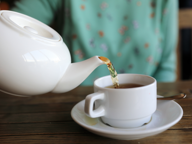 pouring tea teapot spilling tea