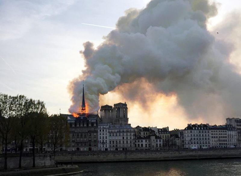 Smoke billows from the Notre Dame Cathedral after a fire broke out, in Paris.JPG