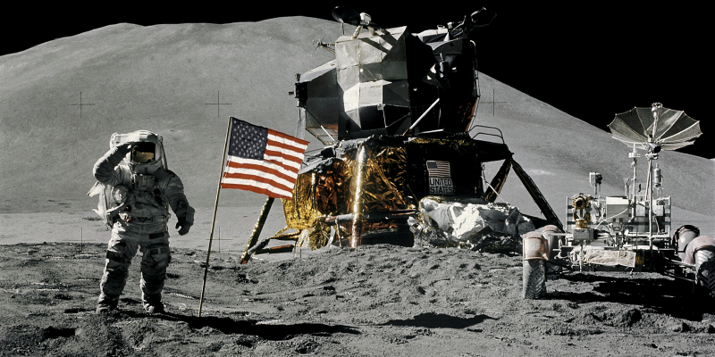 FILE PHOTO: Astronaut James Irwin, lunar module pilot, gives a military salute while standing beside the U.S. flag during Apollo 15 lunar surface extravehicular activity (EVA) at the Hadley-Apennine landing site on the moon, August 1, 1971. NASA/David Scott/Handout via REUTERS