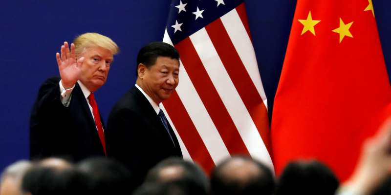 FILE PHOTO: U.S. President Donald Trump and China's President Xi Jinping meet business leaders at the Great Hall of the People in Beijing, China, November 9, 2017. REUTERS/Damir Sagolj/File Photo