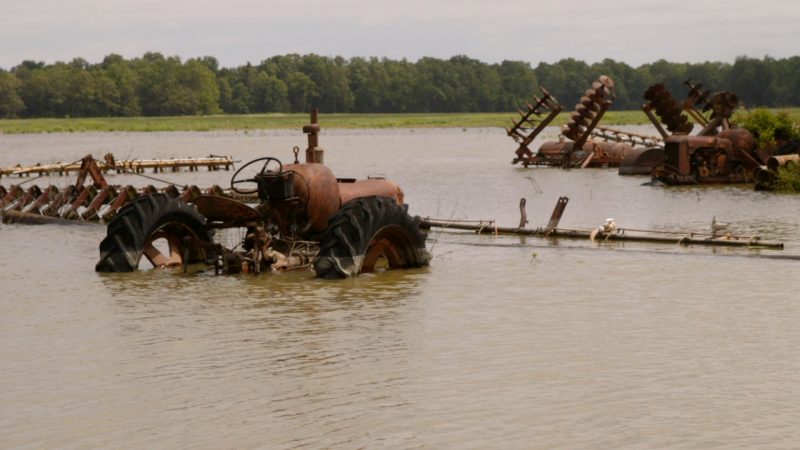 Tractors underwater in Mississippi Delta flooding