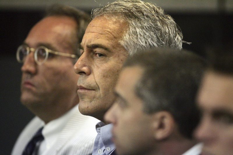 FILE - In this July 30, 2008, file photo, Jeffrey Epstein, center, appears in court in West Palm Beach, Fla.  At the center of Epstein's secluded New Mexico ranch sits a sprawling residence the financier built decades ago, complete with plans for a 4,000-square-foot (372-square-meter) courtyard, a living room roughly the size of the average American home and a nearby private airplane runway. Known as the Zorro Ranch, the high-desert property is now tied to an investigation that the state attorney general's office says it has opened into Epstein with plans to forward findings to federal authorities in New York.  (Uma Sanghvi/Palm Beach Post via AP, File)