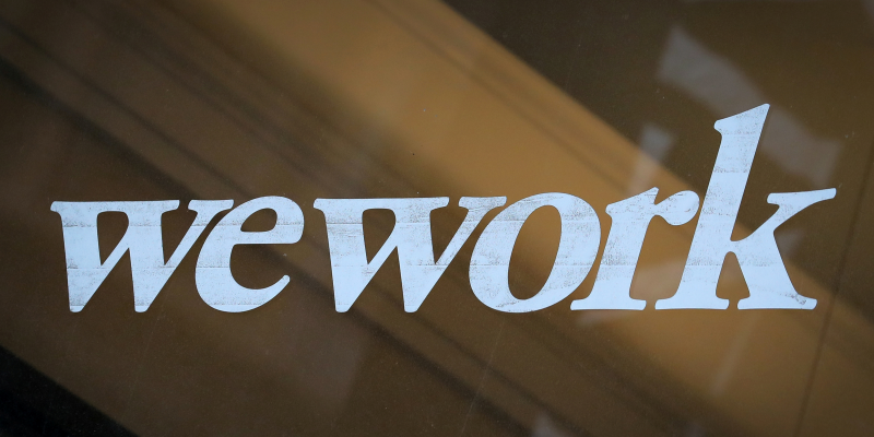 FILE PHOTO: The WeWork logo is displayed on the entrance of a co-working space in New York City, New York U.S., January 8, 2019. REUTERS/Brendan McDermid/File Photo