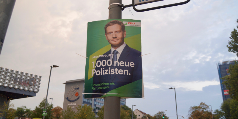 A campaign poster for the Christian Democrats promises 1,000 new police officers for the eastern state of Saxony.