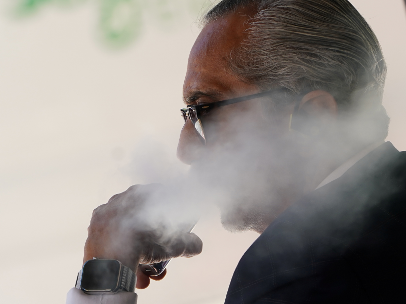 FILE PHOTO: A man uses a vaping product in the Manhattan borough of New York, New York, U.S., September 17, 2019. REUTERS/Carlo Allegri