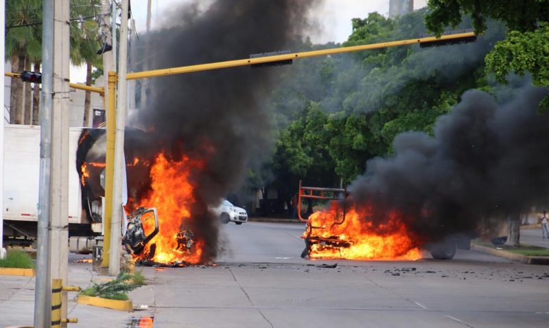 Vehicles burn in a street of Culiacan, state of Sinaloa, Mexico, on October 17, 2019.