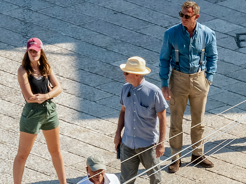 In this Sept. 12, 2019 photo, actor Daniel Craig, right, is seen on the set of the latest James Bond movie 'No time to die' in Matera, southern Italy. The film is due out in spring 2020. (AP Photo/Fabio Dell'Aquila)