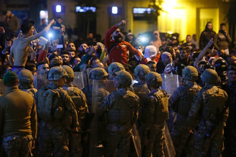 Lebanese army soldiers and riot police are deployed after clashes broke out between anti-government demonstrators and supporters of the Shi'ite movements Hezbollah and Amal in Beirut, Lebanon, November 25, 2019. REUTERS/Mohamed Azakir