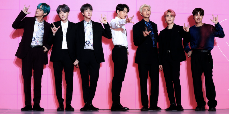Members of South Korean K Pop group BTS pose for photos during a press conference to introduce their new album 