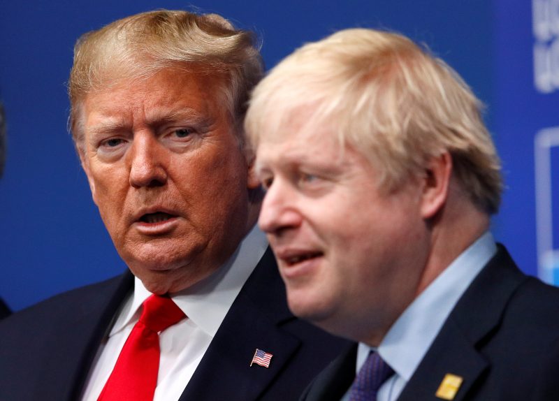 FILE PHOTO: Britain's Prime Minister Boris Johnson welcomes U.S. President Donald Trump at the NATO leaders summit in Watford, Britain December 4, 2019. REUTERS/Peter Nicholls/Pool