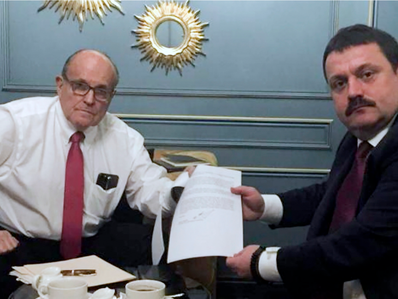 In this handout photo provided by Adriii Derkach's press office, Rudy Giuliani, an attorney for U.S President Donald Trump, left, meets with Ukrainian lawmaker Adriii Derkach in Kyiv, Ukraine, Thursday, Dec. 5, 2019. A Ukrainian lawmaker says he has met up with Rudy Giuliani, President Donald Trump’s personal attorney, in Kyiv to discuss an anti-corruption project. Derkach, who has previously accused the son of former Vice President Joe Biden of embezzling money from a gas company in Ukraine, posted photos of Thursday’s meeting on his Facebook page. (Adriii Derkach's press office via AP)