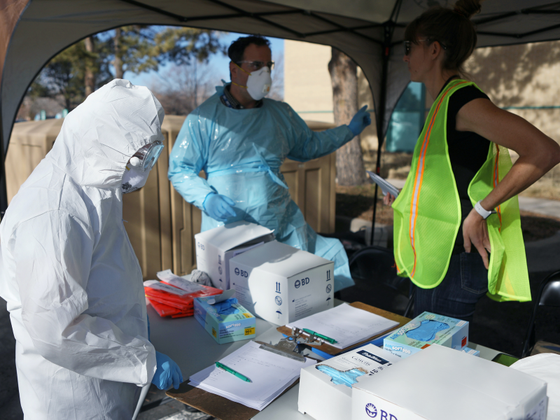 Health care workers prepare a drive thru testing station run by the state health department, for people who suspect they have novel coronavirus, in Denver, Colorado, U.S. March 11, 2020. REUTERS:Jim Urquhart .JPG