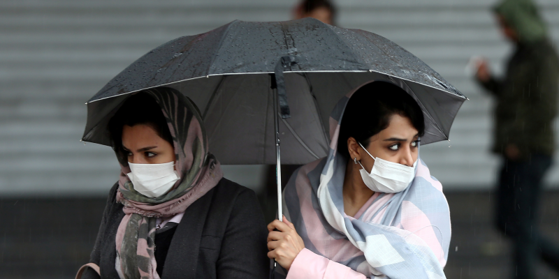 FILE PHOTO: Iranian women wear protective masks to prevent contracting coronavirus, as they walk in the street in Tehran, Iran February 25, 2020. WANA (West Asia News Agency)/Nazanin Tabatabaee via REUTERS 