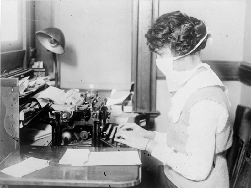 Typist with medical mask, 1918 flu