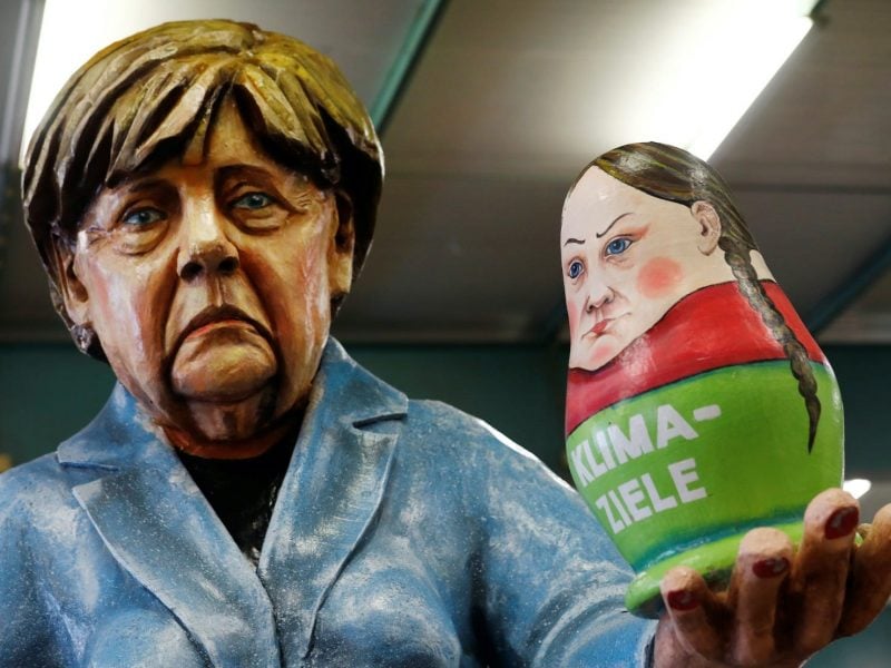 Papier mache figures for carnival floats depicting Germany's Chancellor Angela Merkel and a matryoshka, depicting Swedish environmental activist Greta Thunberg, are pictured during preparations for the upcoming Rose Monday carnival parade in Mainz, Germany, February 18, 2020. REUTERS/Ralph Orlowski