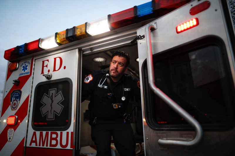 In this April 23, 2020, photo FDNY paramedic Alex Tull, who has recently recovered from COVID-19, prepares to begin his shift outside EMS station 26, the 