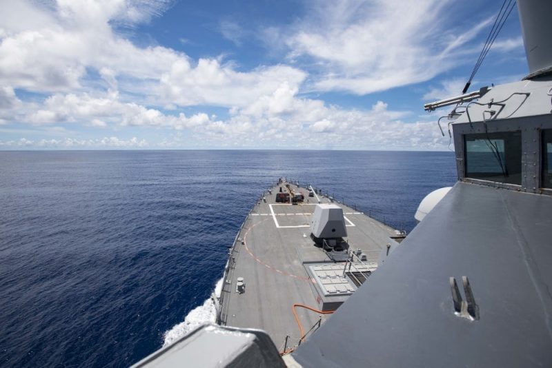 The Arleigh Burke-class guided-missile destroyer USS Ralph Johnson (DDG 114) steams near the Spratly Islands in the South China Sea. Ralph Johnson is deployed conducting maritime security operations and theater security cooperation efforts for a free and open Indo-Pacific.