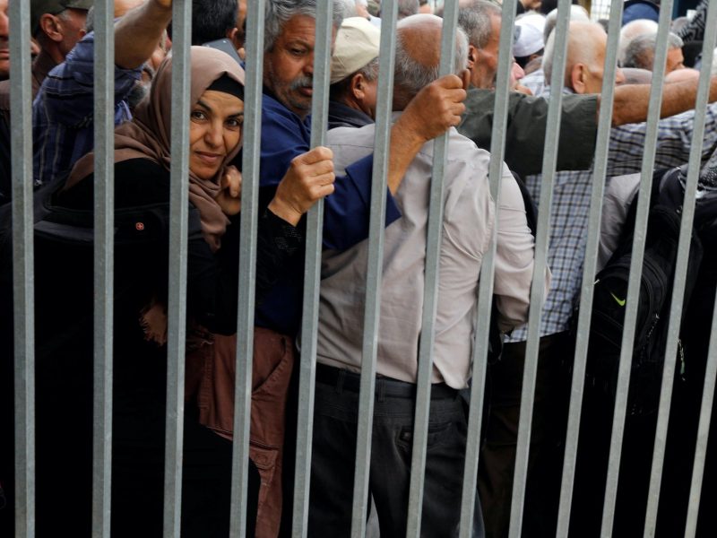 Palestinian workers at Israeli-controlled checkpoint in Jenin, West Bank. May 2019