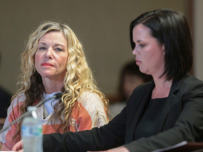 FILE - In this March 6, 2020, file photo, Lori Vallow Daybell glances at the camera during her hearing in Rexburg, Idaho. At her right is defense attorney Edwina Elcox. The Idaho attorney general has agreed to investigate the mother of two missing children and her husband in connection with the death of his first wife. Daybell is being held in an Idaho jail awaiting trial on charges that she abandoned her two kids, 17-year-old Tylee Ryan and 7-year-old Joshua “JJ” Vallow. The kids disappeared in September. (John Roark/The Idaho Post-Register via AP, Pool, File)