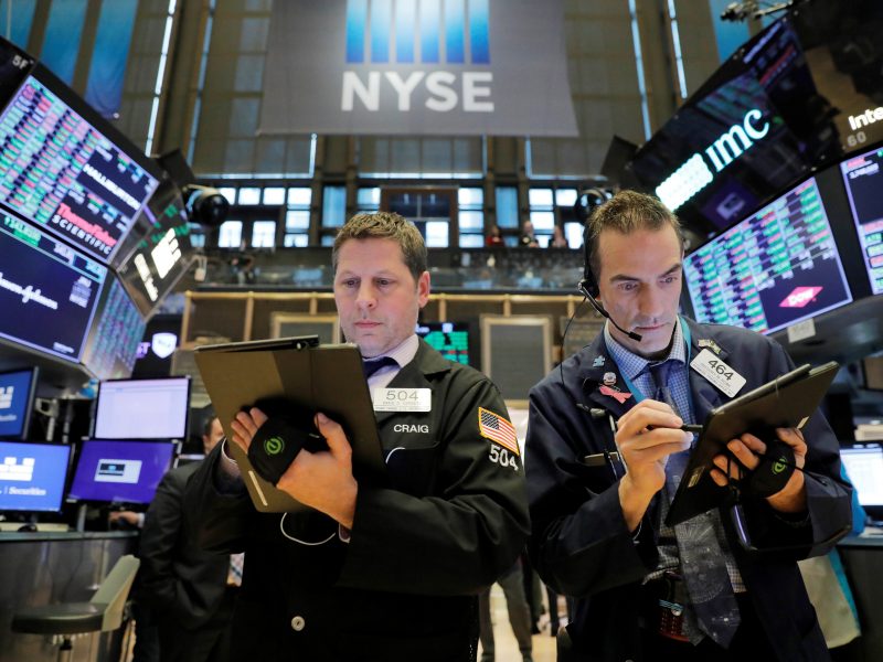FILE PHOTO: Traders work on the floor of the New York Stock Exchange (NYSE) in New York City, New York, U.S., March 10, 2020. REUTERS/Andrew Kelly/File Photo