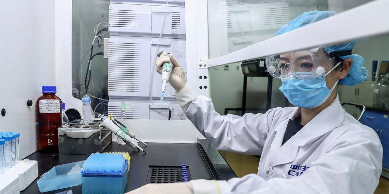 In this April 11, 2020, photo released by Xinhua News Agency, a staff member tests samples of a potential COVID-19 vaccine at a production plant of SinoPharm in Beijing. In the global race to make a coronavirus vaccine, the state-owned Chinese company is boasting that it gave its employees, including top executives, experimental shots even before the government OK'd testing in people. (Zhang Yuwei/Xinhua via AP)