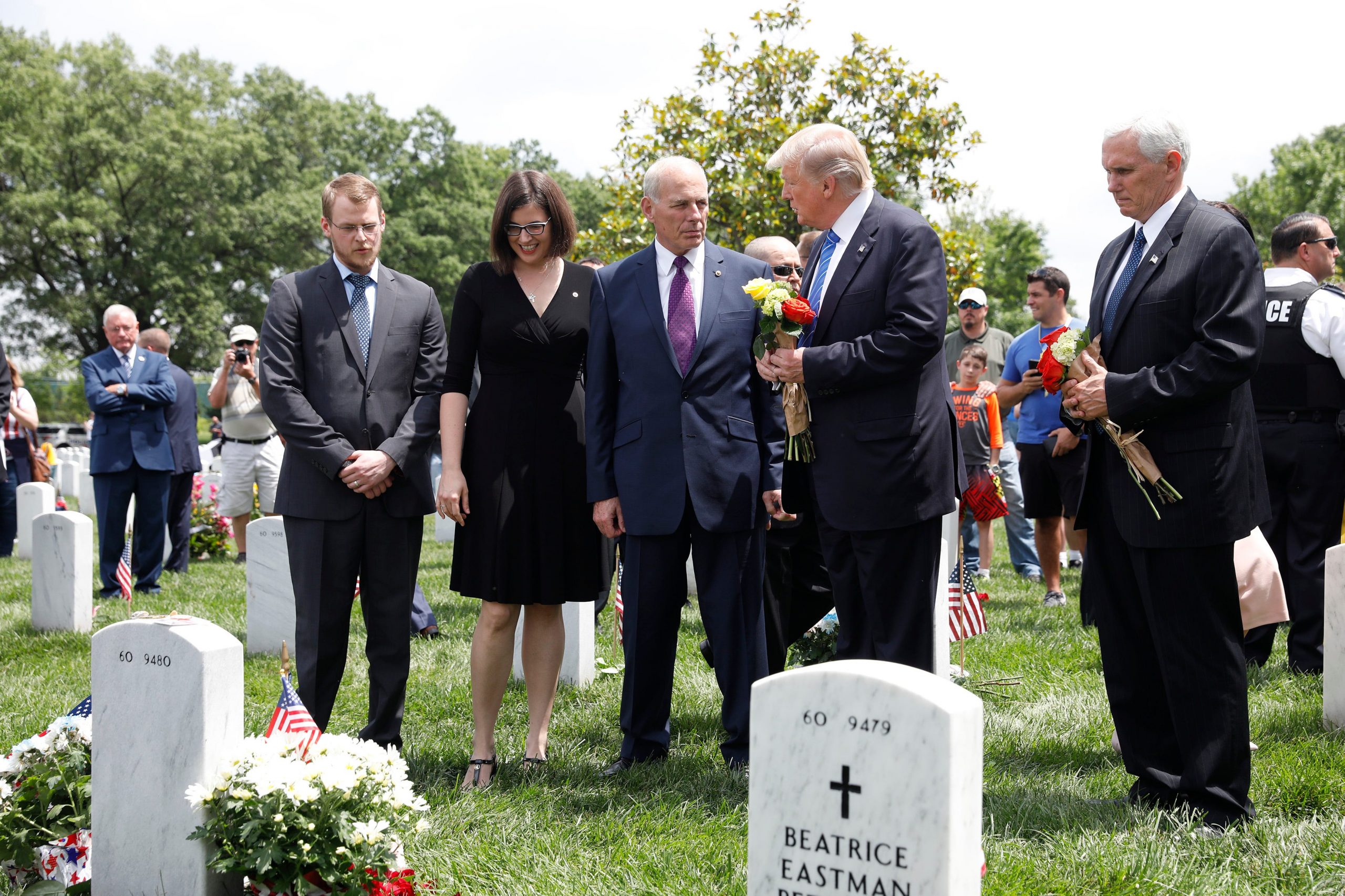 President Donald Trump speaks with retired Marine Corps Gen. John Kelly at Arlington National Cemetery