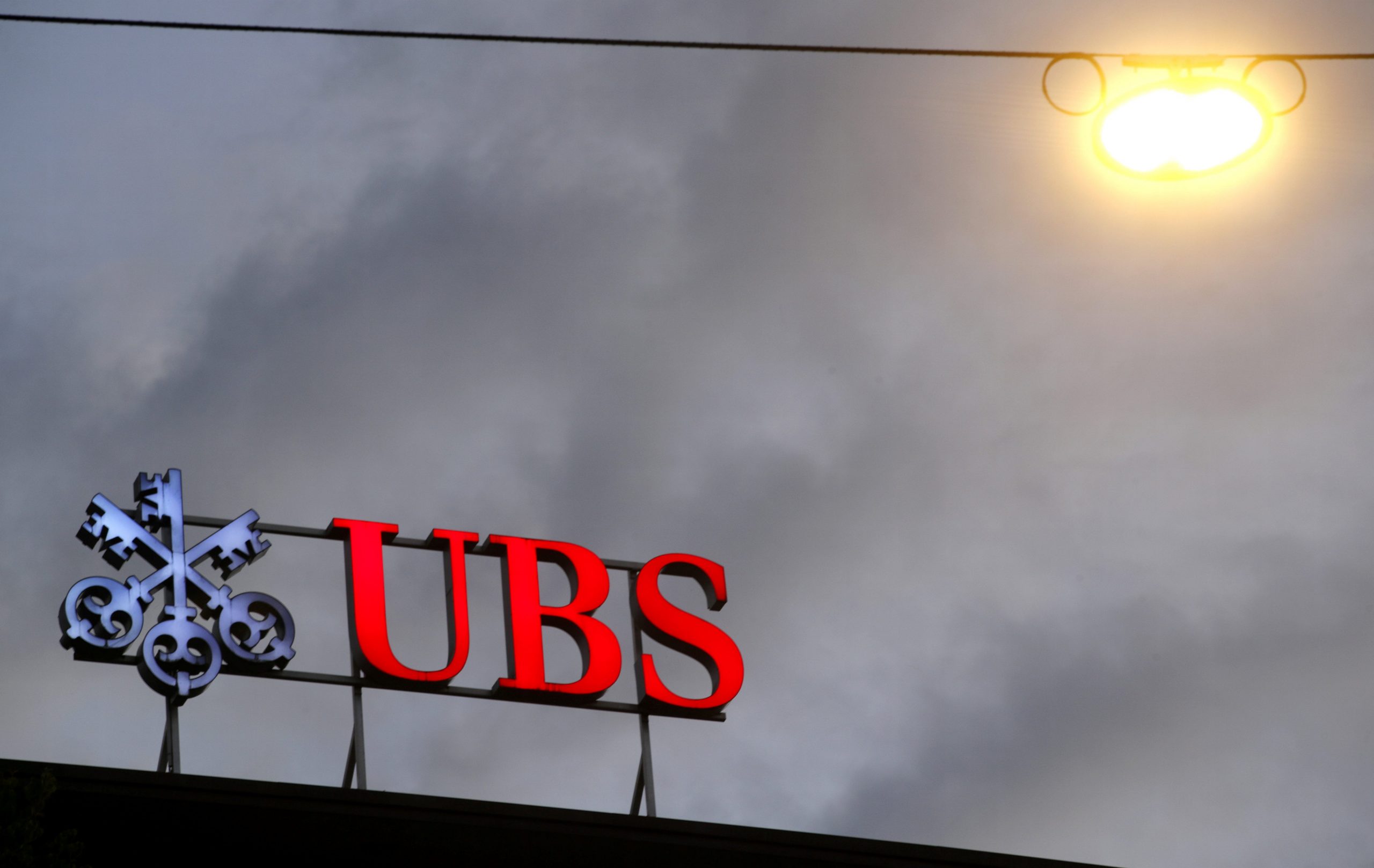 FILE PHOTO: The logo of Swiss bank UBS is seen at a branch office in Zurich, Switzerland June 22, 2020. REUTERS/Arnd Wiegmann