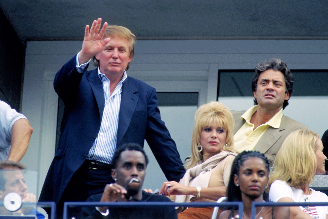 Donald Trump waves from his VIP box at the US Open.