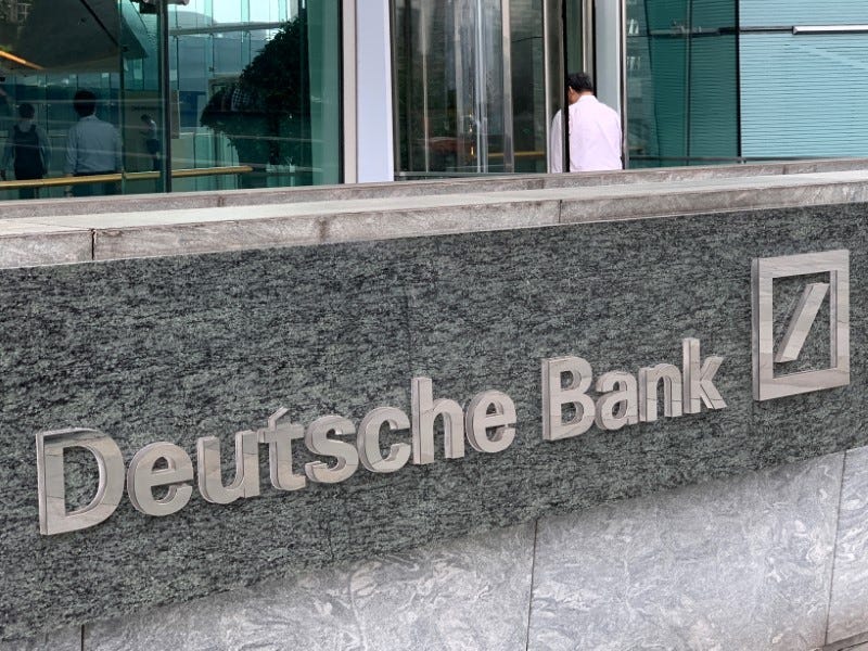 FILE PHOTO: The logo of Deutsche bank is seen in Hong Kong, China July 8, 2019. REUTERS/Tyrone Siu
