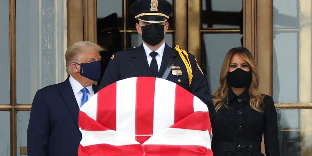 President Donald Trump and First Lady Melania Trump pay their respects to late Associate Justice Ruth Bader Ginsburg as her casket lies in repose at the top of the steps of the U.S. Supreme Court building in Washington, U.S., September 24, 2020.